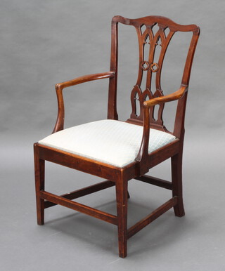 A Chippendale style mahogany carver chair with upholstered drop in seat, raised on square supports 
