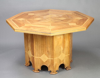 An octagonal Art Nouveau style inlaid mango wood dining table 76cm h x 127cm  