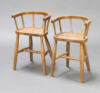 A pair of child's elm tub and stick back chairs 
