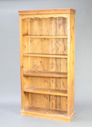 A hardwood 5 tier bookcase with moulded cornice 183cm h x 92cm w x 32cm d 