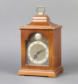 Rotherham, a Queen Anne style bracket timepiece, the arched gilt dial with silvered chapter ring, contained in a walnut case 24cm h x 14cm x 11cm  