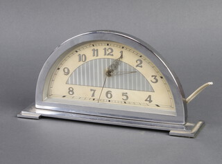 D.R.G.M. a 1930's Art Deco electric mantel timepiece with arched dial and Arabic numerals contained in a chrome case, 11cm x 23cm x 5cm  