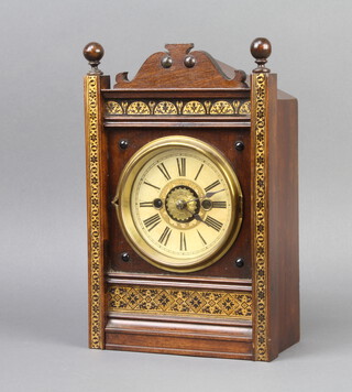 An American striking alarm clock with paper dial, Roman numerals contained in a walnut and gilt painted case, complete with pendulum, no key