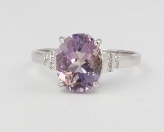 A 9ct white gold oval amethyst and diamond ring, 2.3 grams, size N 1/2