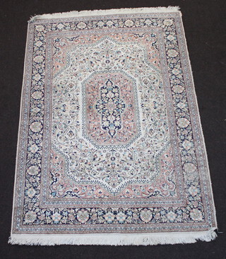 A white and blue silk Kashmir rug with central lozenge within a multi row border 187cm x 124cm 