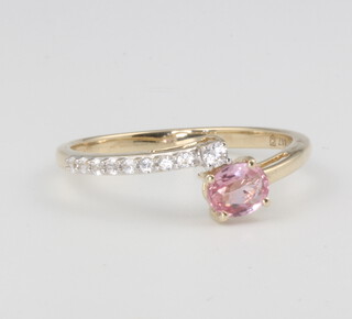 A 9ct yellow gold pink sapphire and diamond ring 1.5 grams, size N 1/2