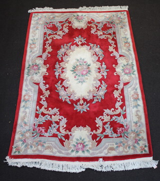 A white and red floral patterned Chinese carpet with central medallion 253cm x 166cm 