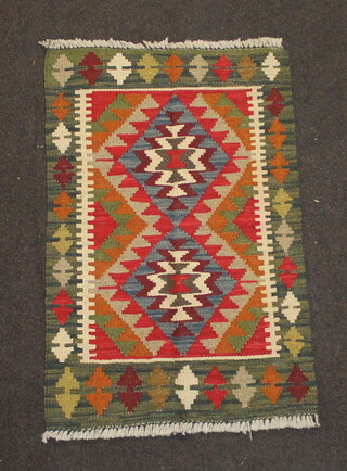 A tan, black and brown ground Maimana Kilim rug 87cm x 57cm 