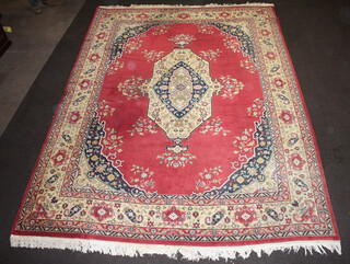 A red and blue ground Persian carpet with central medallion 384cm x 282cm 