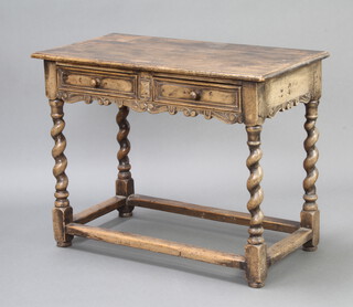 A 17th Century style carved oak side table with shaped apron fitted 2 drawers, raised on spiral turned supports with box framed stretcher 76cm h x 99cm w x 49cm d  
