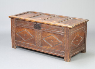 A 17th/18th Century carved oak coffer of panelled construction with hinged lid and iron lock plate to the front 50cm h x 188cm w x 48cm d 