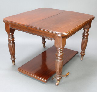 A Victorian mahogany extending dining table with 1 extra leaf, raised on turned and reeded supports 74cm h x 98cm w x 97cm without leaf x 145cm with leaf