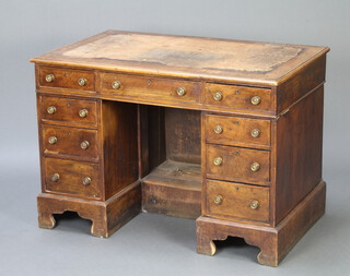 A Victorian bleached walnut kneehole desk/writing table with cross and feather banded top, inset leather writing surface*, fitted 1 long and 8 short drawers, raised on bracket feet 75cm h x 106cm w x 65cm d  