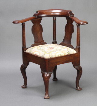 A Georgian mahogany slat back corner chair with upholstered drop in seat, raised on cabriole supports 