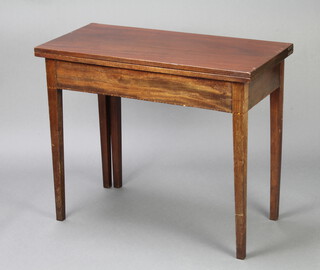 A Georgian rectangular mahogany tea table on square supports 75cm h x 90cm w x 44cm d  