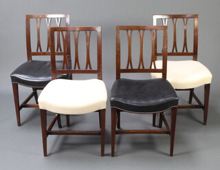 A set of 4 Georgian mahogany stick and rail back dining chairs with overstuffed seats, 2 upholstered in black leather, 2 in white calico, raised on square tapered supports 