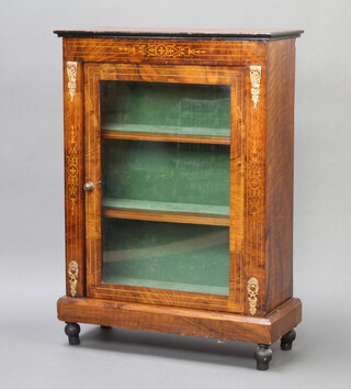 A Victorian inlaid walnut pier cabinet, fitted shelves enclosed by glazed panelled doors and with gilt metal mounts to the sides, raised on bun feet 103cm h x 73cm w x 30cm d  