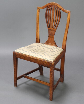 A 19th Century country oak Hepplewhite style dining chair with pierced vase shaped slat back and upholstered drop in seat, raised on square supports with H framed stretcher 