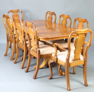 A Queen Anne style figured walnut dining suite comprising twin pillar extending dining table with extra leaf 74cm h x 178cm l x 231cm when extended together with 8 slat back dining chairs with upholstered drop in seats, raised on cabriole supports - 2 carvers and 6 standard 
