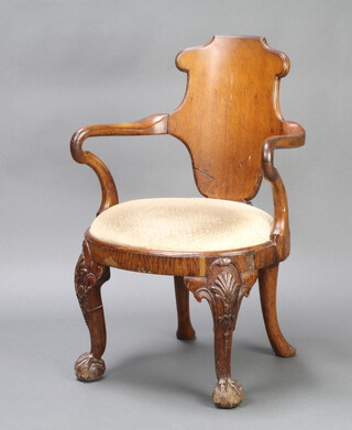 A Georgian style oak slat back carver chair raised on cabriole ball and claw supports