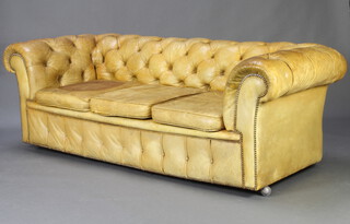 A bleached green leather 3 seat Chesterfield upholstered in buttoned leather 68cm h x 211cm w x 84cm d 