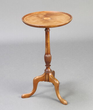 An Edwardian circular bleached mahogany wine table raised on a turned column and tripod base 52cm h x 30cm 