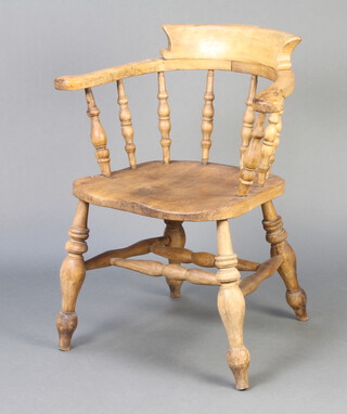A 19th Century light elm bow chair with solid elm seat and double H framed stretcher 
