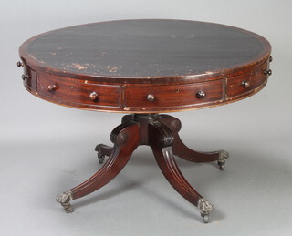 A circular Georgian mahogany drum table with black inset leather writing surface, fitted 5 drawers, raised on turned column and tripod base ending in paw feet 77cm h x 120cm diam. 