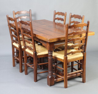 An 18th Century style oak dining suite comprising draw leaf dining table on turned and block supports with H framed stretcher 76cm h x 85cm w x 160cm l x 236cm when extended, together with a set of 6 ladder back chairs with woven rush seats on turned supports