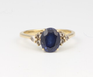 A 18ct yellow gold oval sapphire and diamond ring, the centre stone 2ct, the 6 brilliant cut diamonds 0.18ct, size P, 4.2 grams 