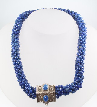 A lapis lazuli bead necklace with repousse silver clasp 36cm 