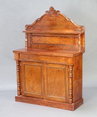 A Victorian mahogany chiffonier, the raised back fitted a shelf, the base fitted a drawer above cupboard enclosed by panelled doors, raised on a platform base 146cm h x 100cm w x 41cm d 