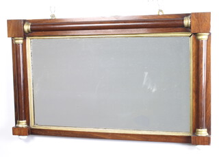 A William IV rectangular plate mirror contained in a rosewood frame with column decoration, raised on ceramic bun feet 52cm h x 84cm w x 5cm d 
