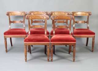 A set of 6 Georgian carved Scots mahogany bar back dining chairs with carved mid rails and overstuffed seats, raised on turned supports 