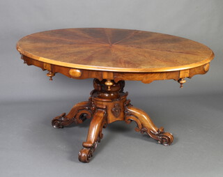A Victorian Scottish oval inlaid walnut snap top breakfast table with quadrant veneers and veneered star to the centre, the apron with turned finials, raised on a bulbous turned and  tripod column base 71cm h x 153cm w x 107cm d 