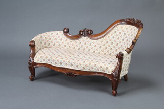 A child's Victorian style mahogany show frame sofa raised on cabriole supports 48cm h x 70cm w x 26cm d 