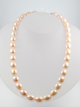A string of cultured pearls with an 18ct yellow gold clasp 42cm 