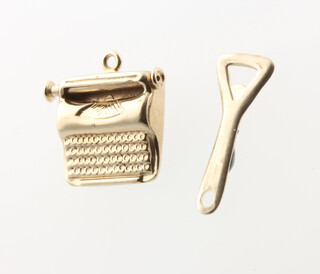 Two 9ct yellow gold charms in the form of a bottle opener and a typewriter 1.7 grams 
