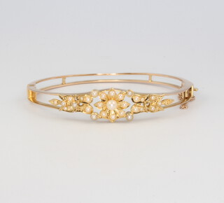 A 9ct yellow gold pearl set bangle, 15.5 grams