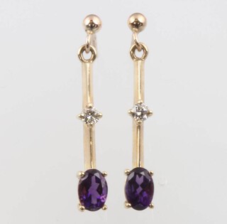 A pair of 9ct yellow gold amethyst and diamond drop earrings, amethysts approx. 1ct, the diamonds approx. .06ct, 22mm long, 2.3 grams 