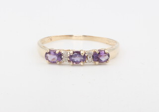 A 9ct yellow gold amethyst and diamond ring 0.9 grams, size N 1/2