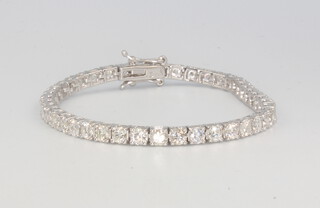 An 18ct white gold diamond tennis bracelet, comprising 43 diamonds approx. 7.6ct, 16.5cm