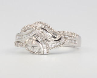 An 18ct white gold baguette and diamond crossover ring approx. 0.43ct, size M 