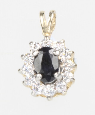 A 9ct yellow gold blue sapphire and paste pendant 1.2 grams, 10mm