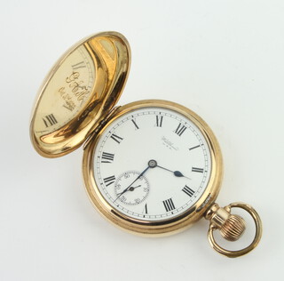 A gold plated Waltham hunter pocket watch with seconds at 6 o'clock 