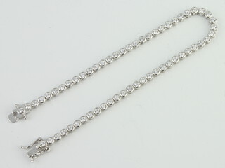 A silver and paste tennis bracelet 