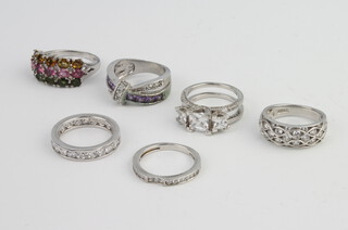 A silver paste ring size M and 4 others