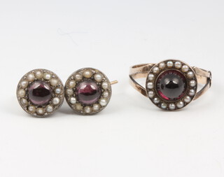A yellow gold cabochon garnet and seed pearl ring size N together with a pair of similar earrings, gross weight 5.8 grams 