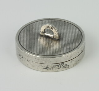 A circular silver engine turned pill box, London 1958, maker Asprey and Co, 35mm, 16 grams 