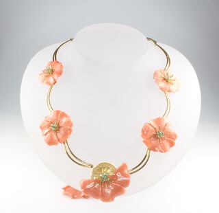An Italian 18ct yellow gold and coral necklace, carved with 5 flower heads, set with emeralds 38cm, gross weight 64 grams 